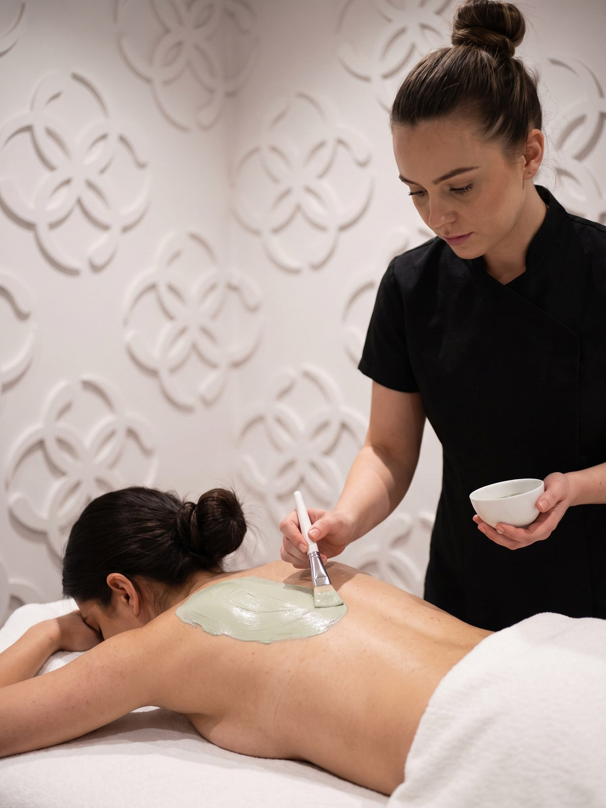 Back facial in the treatment room at Kingdom of Beauty, Abu Dhabi