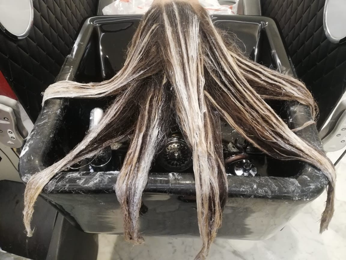Balayage lightening in progress at Kingdom of Beauty, Abu Dhabi