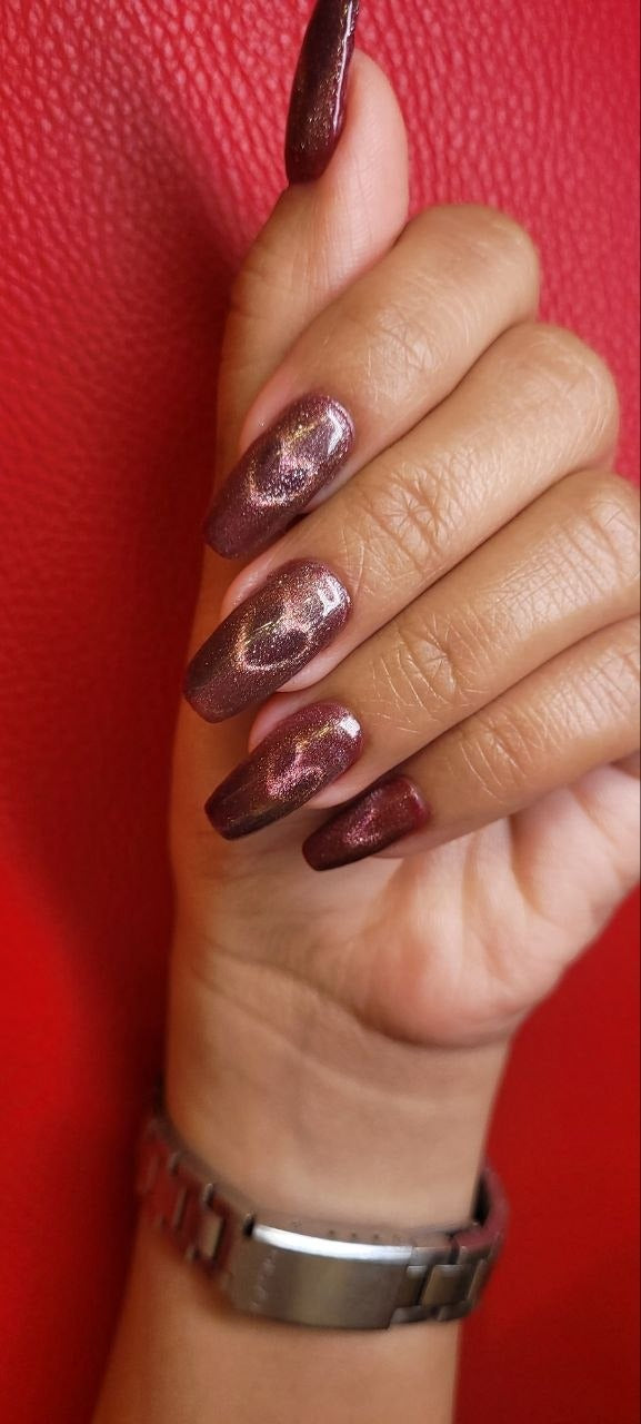 Burgundy cat-eye glitter nails at Kingdom of Beauty, Abu Dhabi