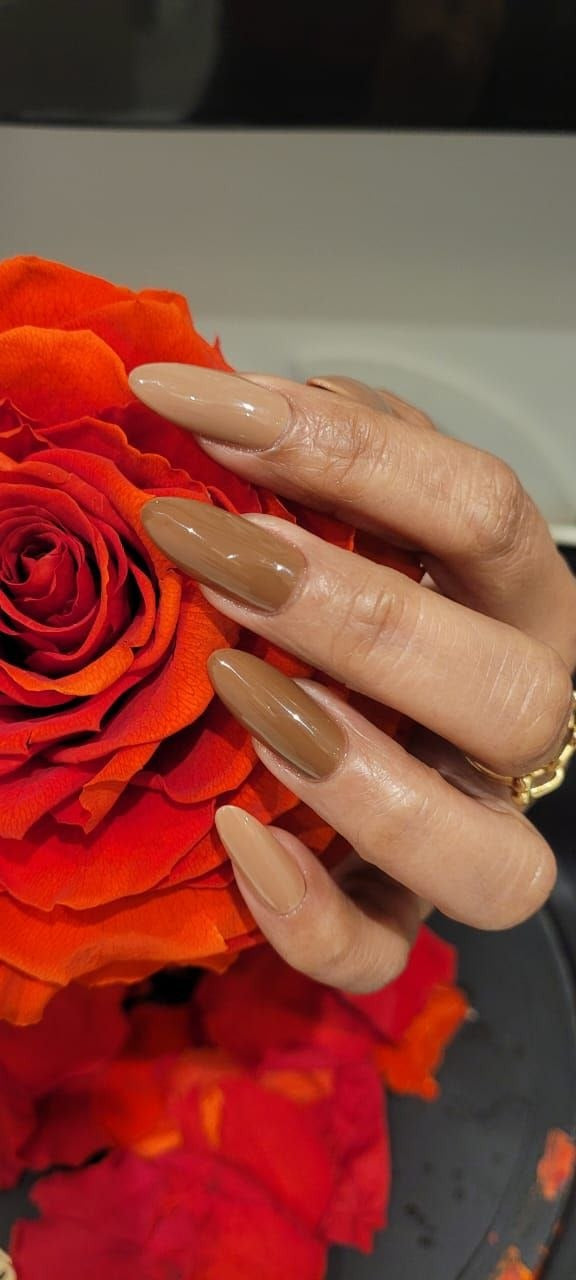 Caramel nude almond nails with a rose at Kingdom of Beauty, Abu Dhabi