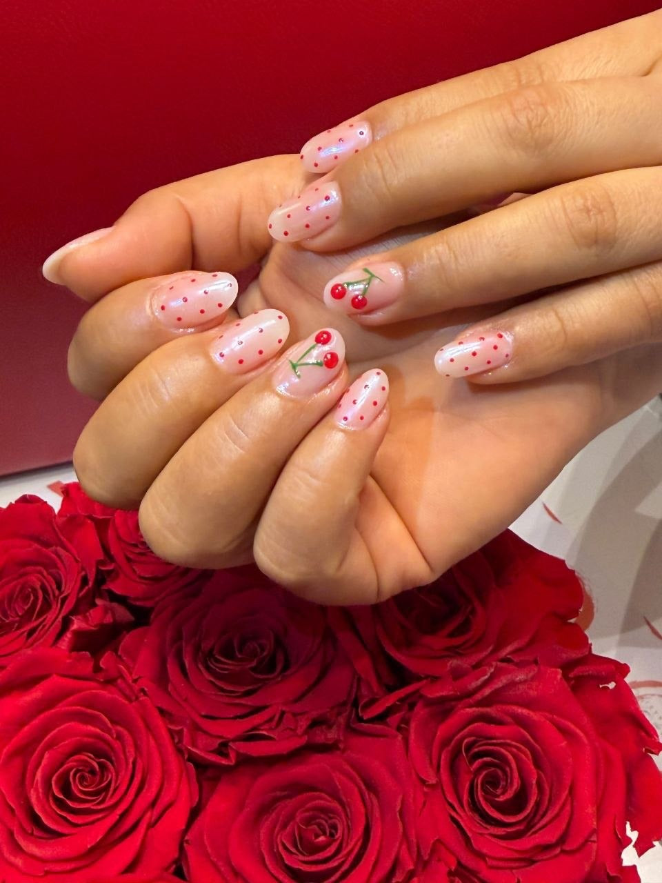 Cherry and red polka dot nail art at Kingdom of Beauty, Abu Dhabi