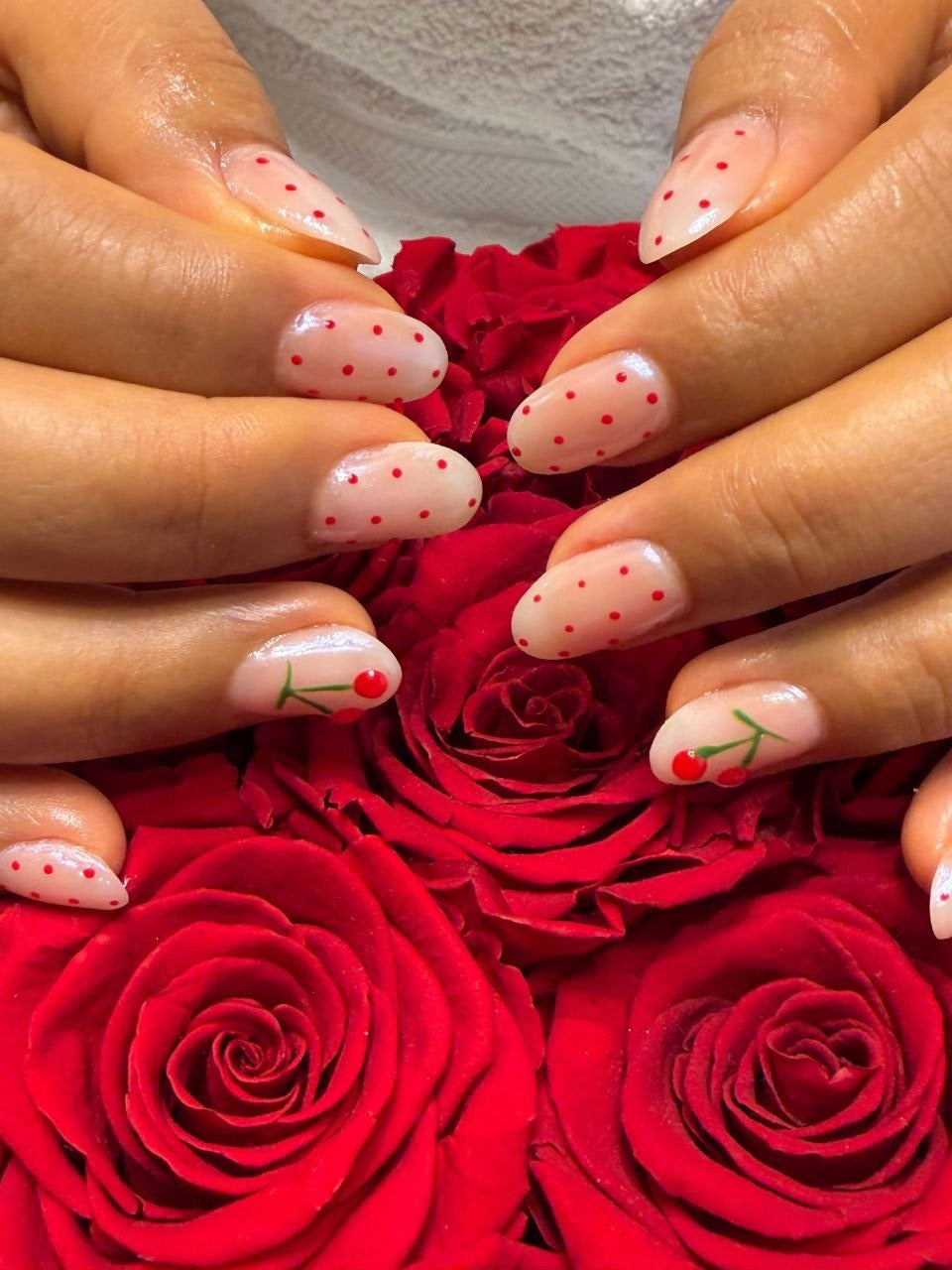 Cherry nail art on red roses at Kingdom of Beauty, Abu Dhabi