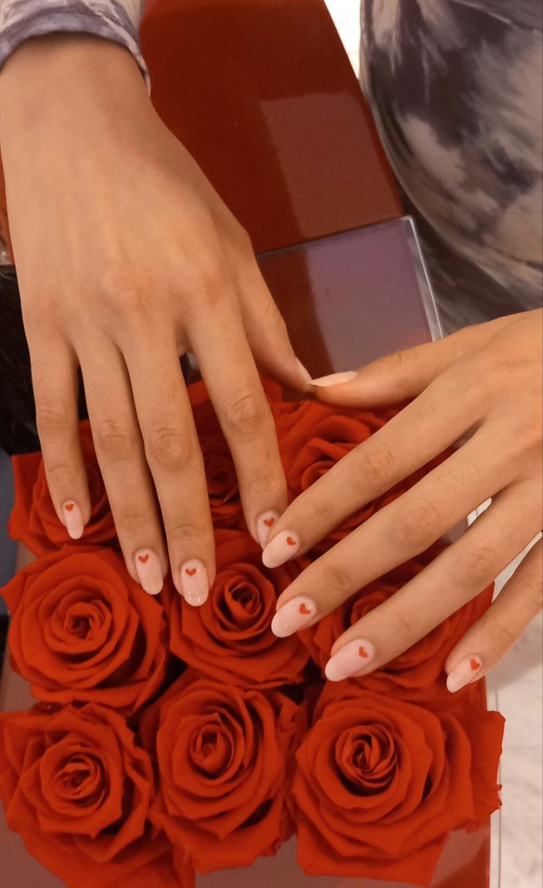 Tiny red heart nail art on roses by Kingdom of Beauty, Abu Dhabi