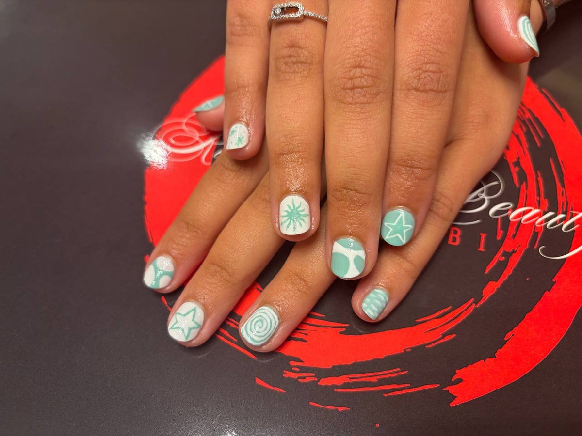 Mint green star nail art at Kingdom of Beauty, Abu Dhabi