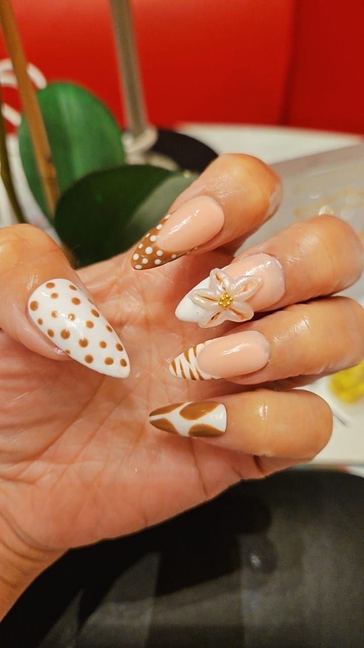 Safari print nail art with a 3D flower at Kingdom of Beauty, Abu Dhabi