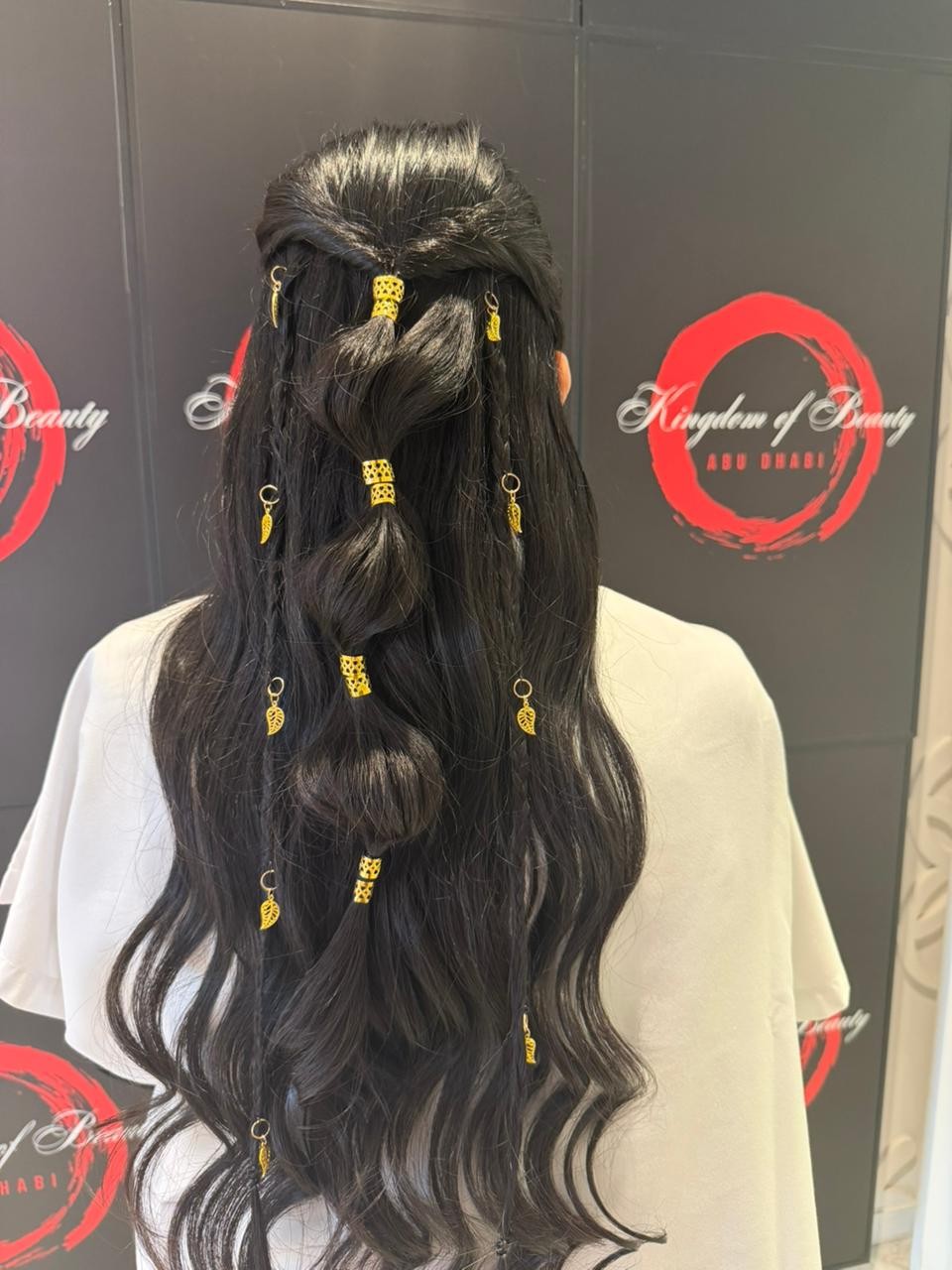 Half-up bubble braid with gold charms by Kingdom of Beauty, Abu Dhabi