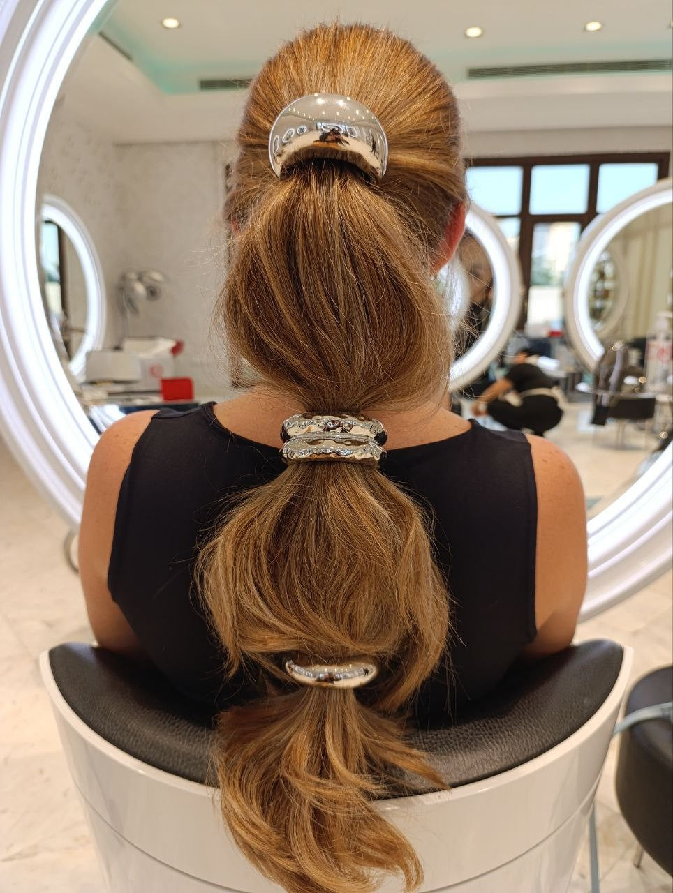Bubble ponytail with silver cuffs by Kingdom of Beauty, Abu Dhabi